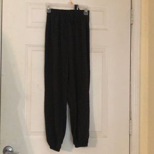 Black parachute type pants with ties.